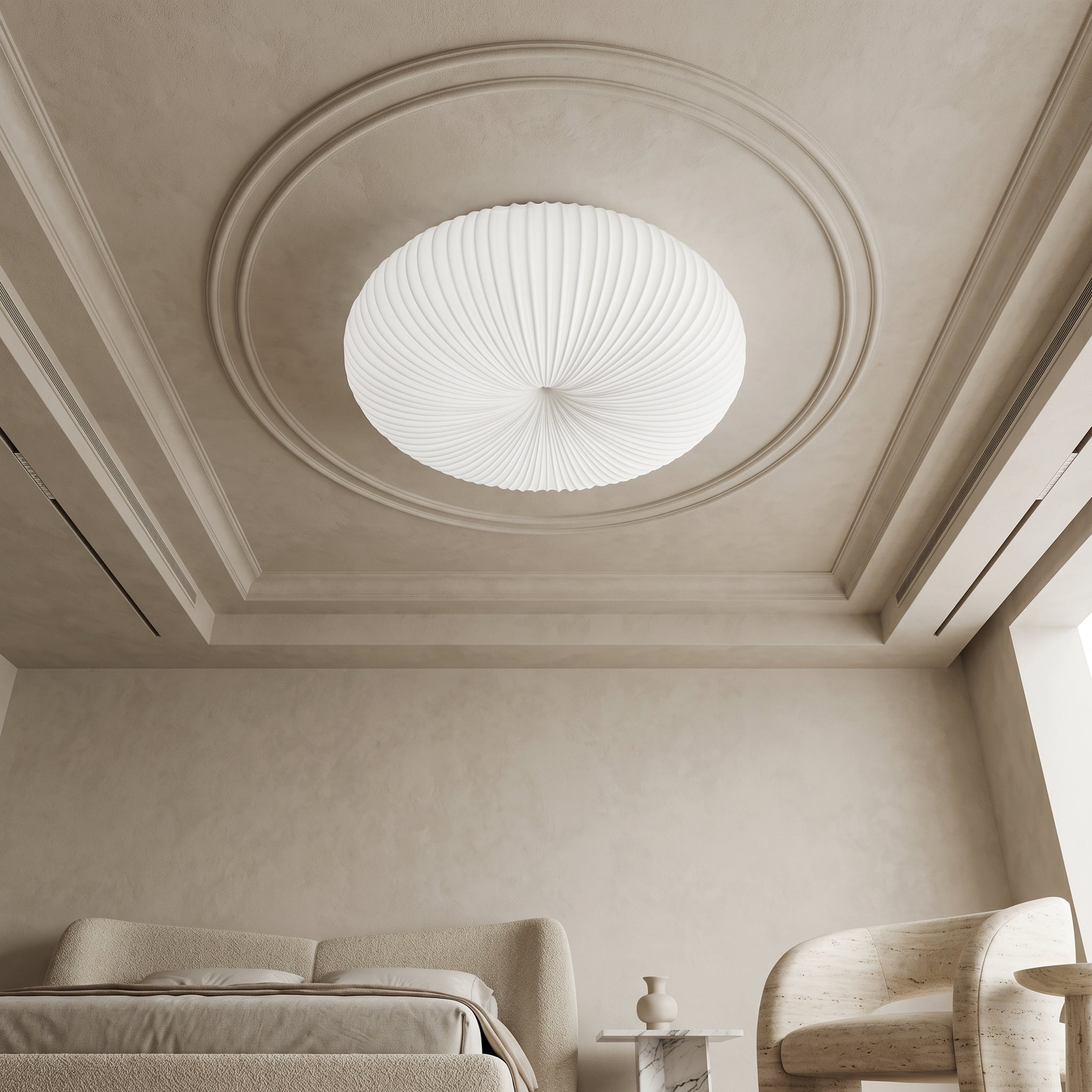 White Bobby flush ceiling light fitted within ornate plaster ceiling medallion above neutral bedroom with bouclé furniture