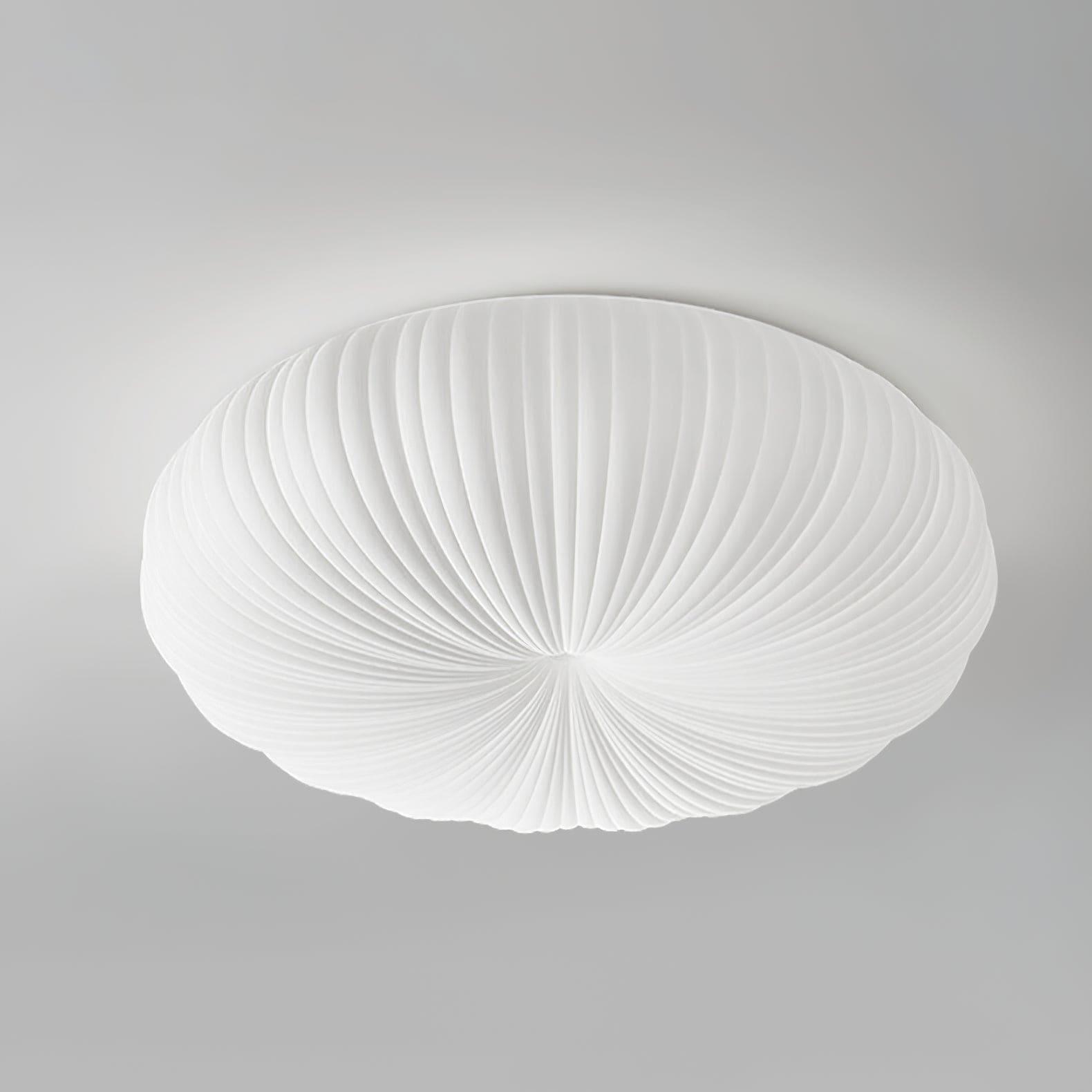 Close up product shot of white Bobby flush ceiling light showing ribbed PE acrylic diffuser detail on grey background
