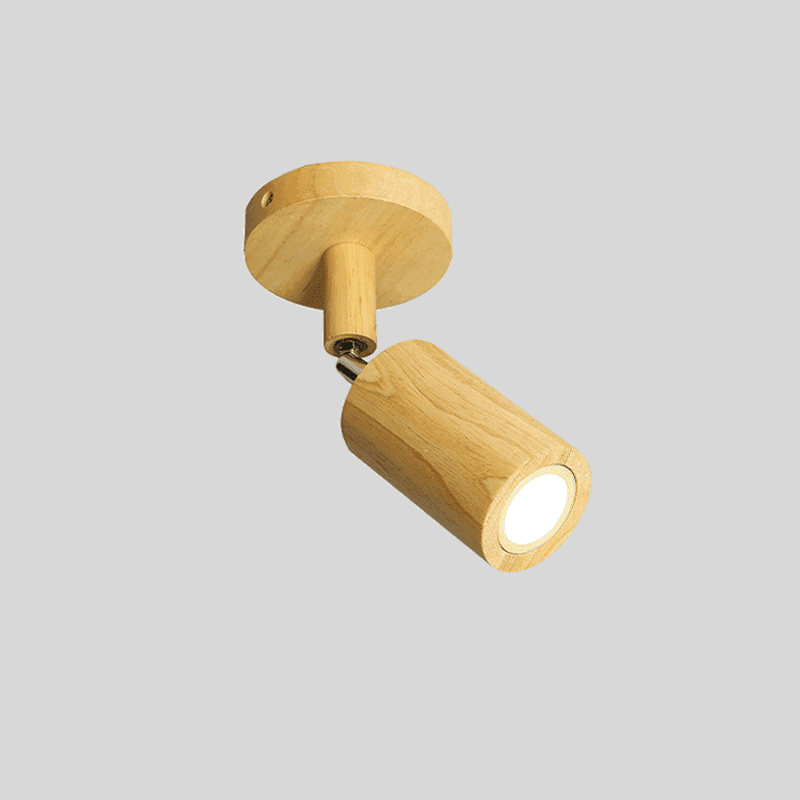 Natural wood Merlo single spotlight on round ceiling mount with warm LED glow on grey background