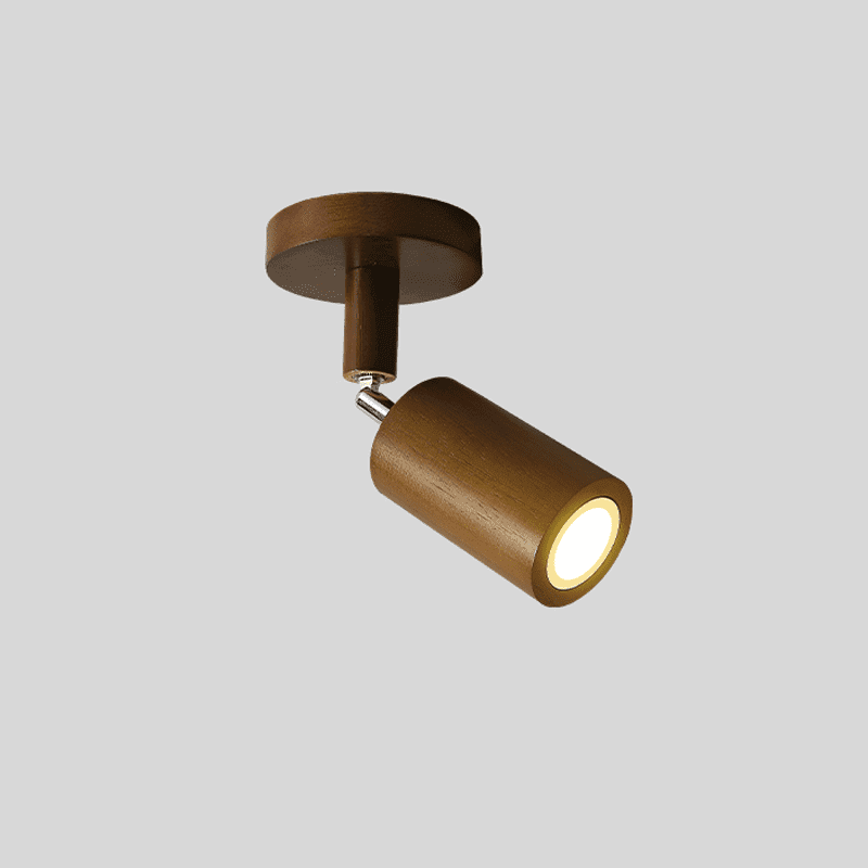 Walnut Merlo single wood spotlight on round ceiling mount with warm LED glow on grey background