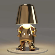 Gold RayDudes sunset lamp in confident standing pose with warm glow