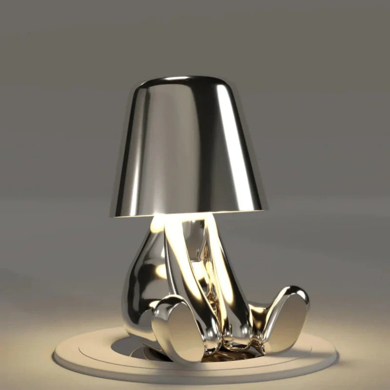 Silver RayDudes sunset lamp in dismayed hunching pose with warm glow